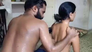 Husband gives a full-body massage to his wife