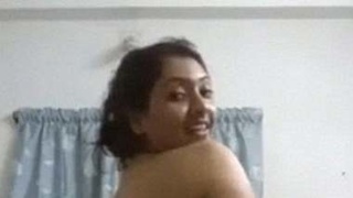 Naughty Indian babe with big boobs goes nude