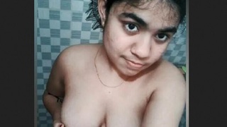 A cute desi girl gets naked in the bathtub