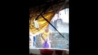 Indian girl enjoys outdoor shower in the nude