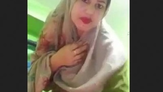 Naughty wife in hijab gets naked and shows off her body