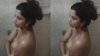 Hidden camera captures a stunning girl getting naked in the shower