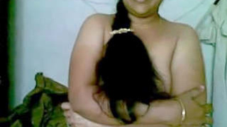 Indian bhabhi in a sari shows off her curves in MMS