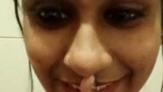 Indian girl teases with her fingers during a video call