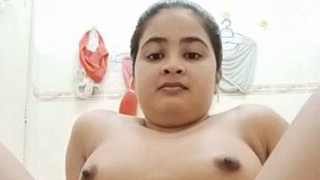 Watch a stunning Indian girl in the bathtub, completely naked and at ease