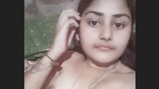 Watch a stunning girl pleasure herself with her smooth pussy
