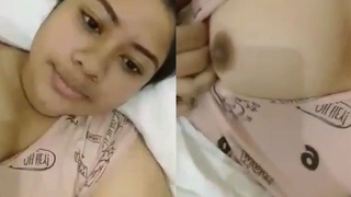 A young girl flaunts her ample bosom in a sensual video