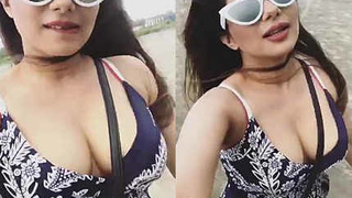 Busty Indian model flaunts her curves on a beach