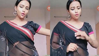 Busty beauty in saree flaunts her round belly and big boobs