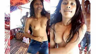 Watch a stunning Desi babe strip down and dance topless