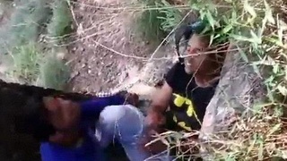 A young Indian couple caught having sex in public runs for their lives