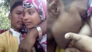 Couple enjoys outdoor fun with teen girlfriend showing off her breasts