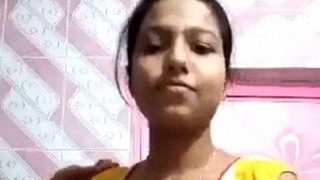 Bangladeshi teenage girl's solo strip and striptease in a bedroom