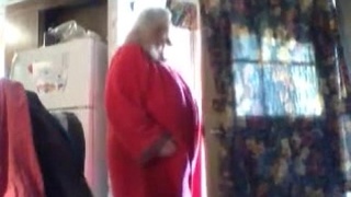 Mature landlord reveals her big tits in a voyeuristic webcam video