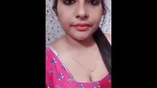 Desi babe with massive boobs strips and crushes them in front of the camera