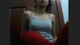 Watch a gorgeous girl strip down to her lingerie