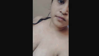 A seductive woman shows off in the bathroom, including in the sink