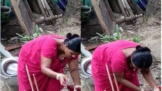 Desi bhabhi's big boobs on display while cleaning