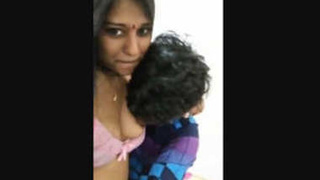 Cute Indian girl's breasts fondled by lover