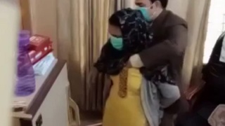 Paki doctor examines woman's breasts by putting his hands inside her blouse