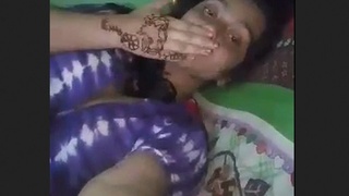 Woman pleasures herself with her fingers in village video