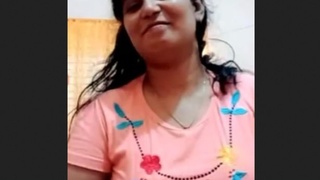 Busty Indian bhabi flaunts her curves and masturbates