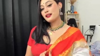 Anna in orange sari: A cute and seductive performance