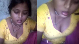 A beautiful girl enjoys a delicious chapathi while showing off her milky cleavage