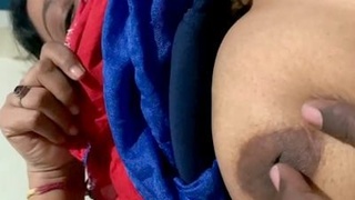 Spy on a busty wife as she masturbates in this hot video