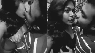 Two Indian girls with big tits share a passionate kiss and fondle each other's breasts